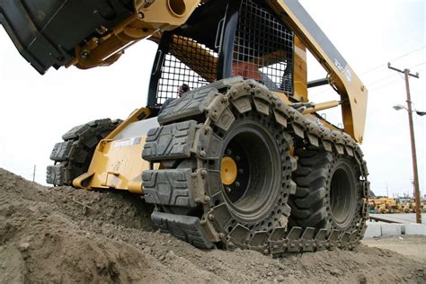 skid steer with tracks vs tires|mounted skid steer tires.